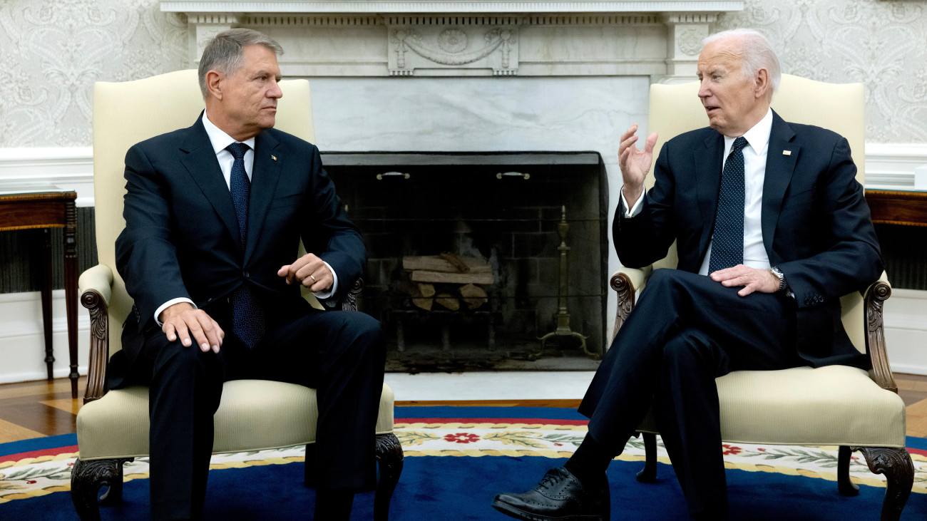 US President Joe Biden, right, and Klaus Iohannis, Romanias president, during a meeting in the Oval Office of the White House in Washington, DC, US, on Tuesday, May 7, 2024. The meeting is meant to mark twenty years since Romania became a member of the North Atlantic Treaty Organization (NATO). Photographer: Michael Reynolds/EPA/Bloomberg via Getty Images