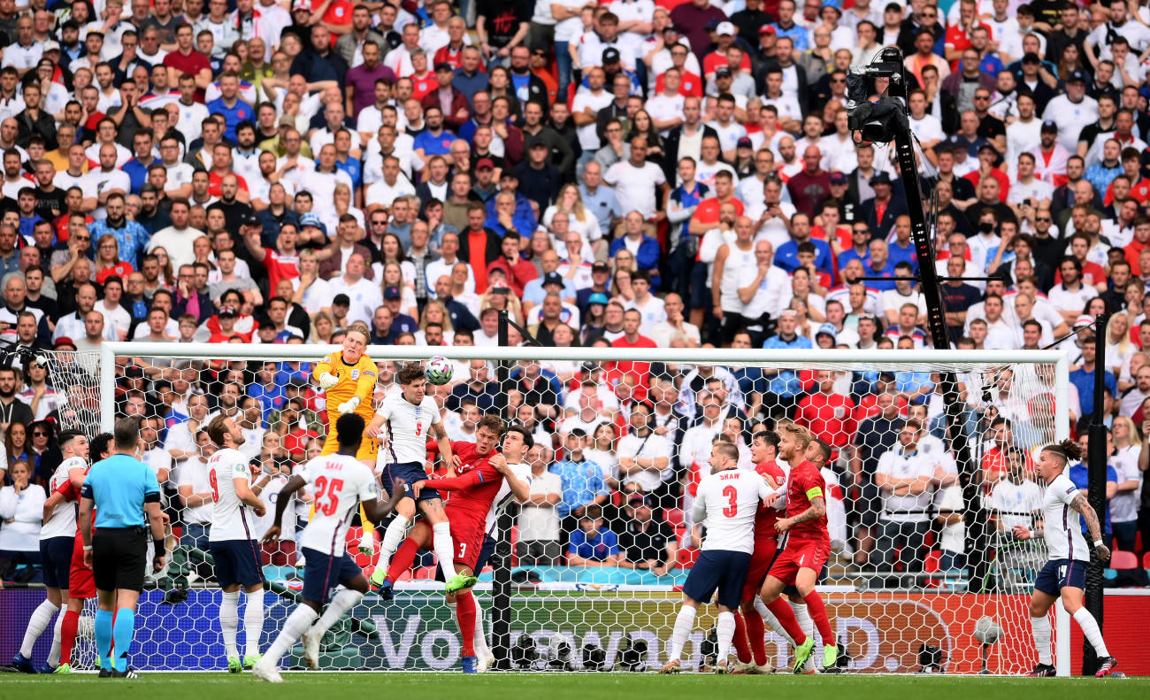 LONDON, ENGLAND - JULY 07: Jordan Pickford of England punches clear from a corner kick during the UEFA Euro 2020 Championship Semi-final match between England and Denmark at Wembley Stadium on July 07, 2021 in London, England. (Photo by Laurence Griffiths/Getty Images)