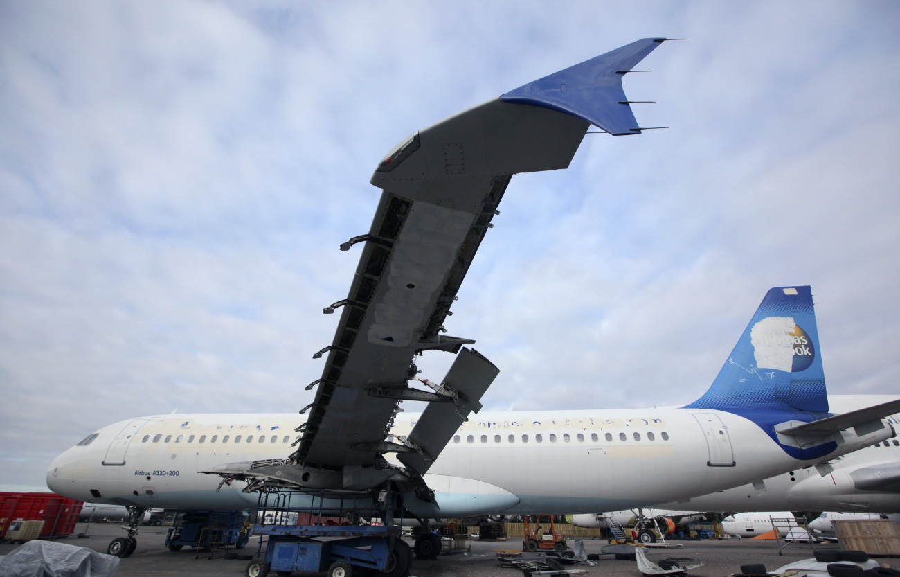 An Airbus A320-200 aircraft, formerly operated by Thomas Cook Group Plc, stands on the tarmac in the yard of Air Salvage International Ltd. at Kemble airfield near Cirencester, U.K., on Friday, Feb. 3, 2012. Disused aircraft generate new money for U.K. airplane salvage company Air Salvage International Ltd. based in Gloucestershire. Photographer: Chris Ratcliffe/Bloomberg via Getty Images