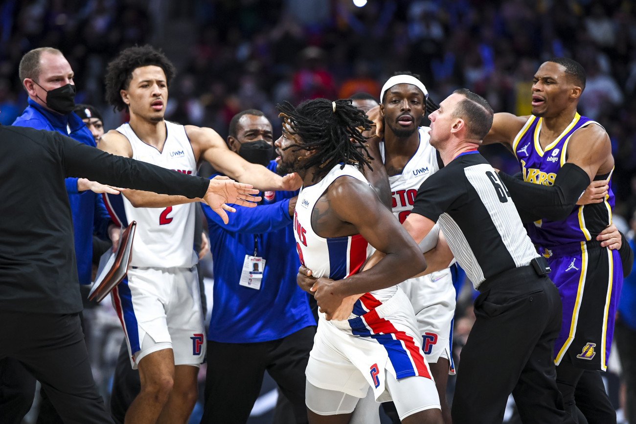 DETROIT, MICHIGAN - NOVEMBER 21: Isaiah Stewart #28 of the Detroit Pistons is restrained as he goes after LeBron James #6 of the Los Angeles Lakers during the third quarter of the game at Little Caesars Arena on November 21, 2021 in Detroit, Michigan. NOTE TO USER: User expressly acknowledges and agrees that, by downloading and or using this photograph, User is consenting to the terms and conditions of the Getty Images License Agreement. (Photo by Nic Antaya/Getty Images)