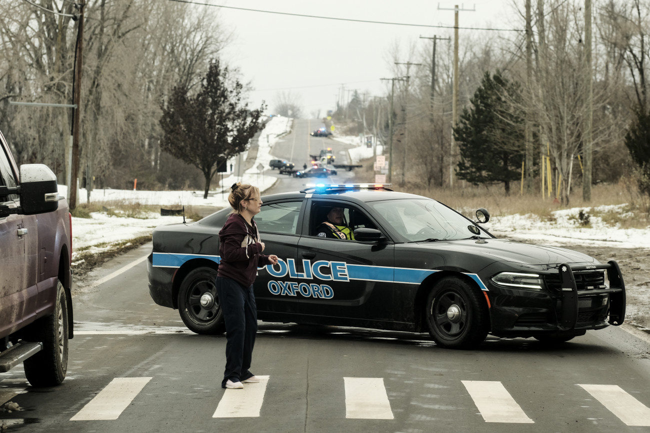 OXFORD, MI - NOVEMBER 30: A police road block restricts access to Oxford High School following a shooting on November 30, 2021 in Oxford, Michigan. According to reports, three people were killed and six others wounded by the alleged perpetrator, a 15 year old student who is now in police custody. (Photo by Matthew Hatcher/Getty Images)