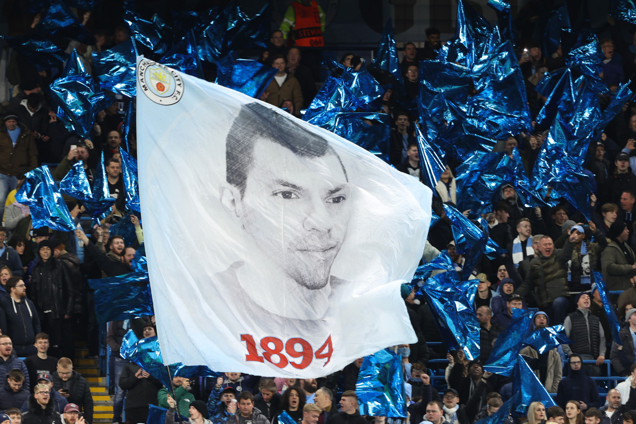 MANCHESTER, ENGLAND - NOVEMBER 03: The We Are 1894 Manchester City supporters group display a flag of Sergio Aguero during the UEFA Champions League group A match between Manchester City and Club Brugge KV at Etihad Stadium on November 3, 2021 in Manchester, United Kingdom. (Photo by Matthew Ashton - AMA/Getty Images)