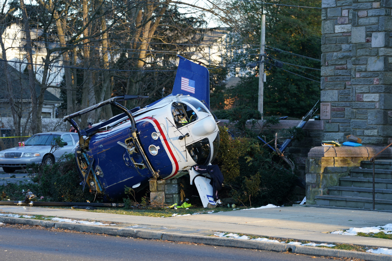 PHILADELPHIA, USA - JANUARY 11: A medical helicopter crash landed on the lawn of the Drexel Hill United Methodist Church in Drexel Hill, PA on January 11th, 2022. Three crew members and a patient were able to escape from this medical helicopter which crashed in front of Drexel Hill United Methodist church Burmont road and Bloomfield Ave. in Upper Darby. Upper Darby police Superintendent Timothy Bernhardt called it a miracle everyone was able to get out. (Photo by Wolfgang Schwan/Anadolu Agency via Getty Images)