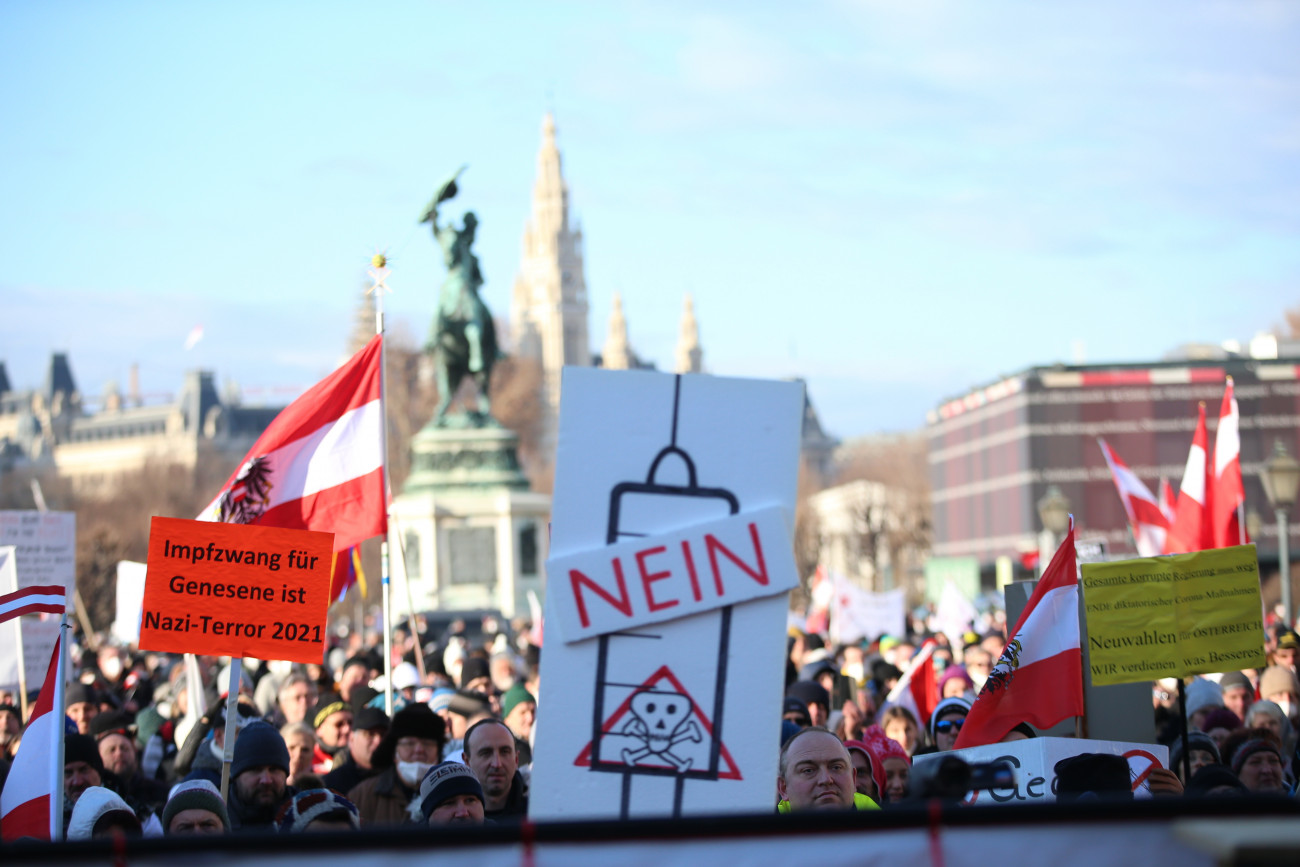 VIENNA, AUSTRIA - JANUARY 08: People holding placards gathered at Heldenplatz to protest the government's Covid-19 measures in Vienna, Austria on January 08, 2022. Security forces intervene in some protesters during the demonstration. (Photo by Askin Kiyagan/Anadolu Agency via Getty Images)