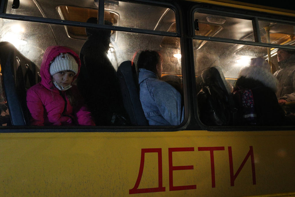 ROSTOV-ON-DON REGION, RUSSIA - FEBRUARY 18, 2022: Evacuees from the Donetsk People's Republic are to be sent to a refugee camp after arriving at the Matveyev Kurgan border crossing checkpoint in Matveyevo-Kurgansky District of Russia's Rostov-on-Don Region. Amid the escalating conflict in east Ukraine, on February 18, 2022, the heads of the separatist republics of Lugansk and Donetsk, Leonid Pasechnik and Denis Pushilin, announced a mass evacuation of residents to Russia. Erik Romanenko/TASS (Photo by Erik Romanenko\TASS via Getty Images)