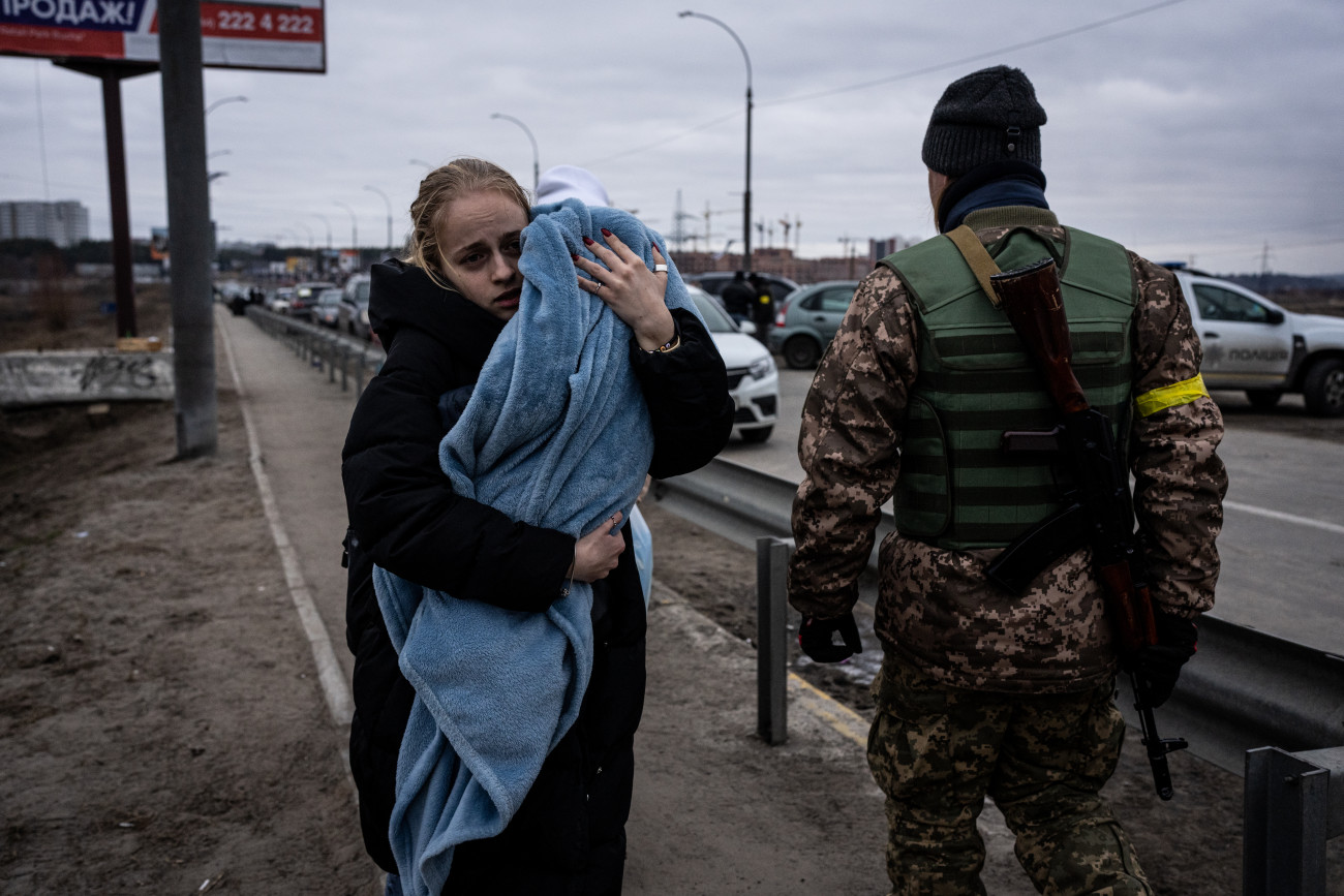 KYIV, UKRAINE - MARCH 05: People evacuate the city of Irpin, northwest of Kyiv, on day 10 of the Russia-Ukraine war on March 5, 2022. (Photo by Wolfgang Schwan/Anadolu Agency via Getty Images)