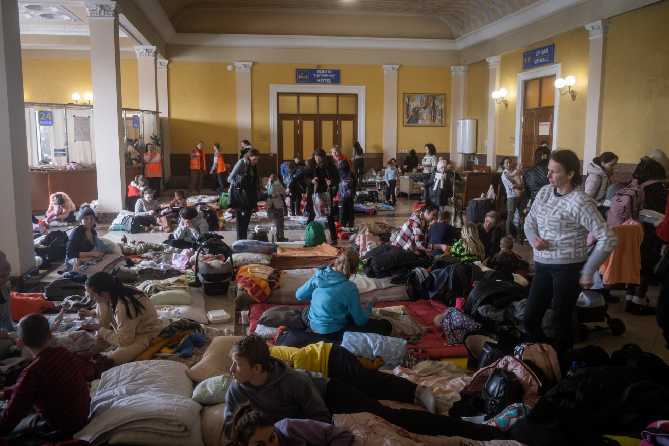 LVIV, UKRAINE - MARCH 07: People wait at the railway station of the western Ukrainian city of Lviv to board a train to leave the country on March 7, 2022, as Russian attacks continue. (Photo by Adria Salido Zarco/Anadolu Agency via Getty Images)
