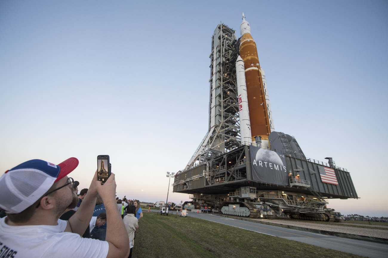 CAPE CANAVERAL, FL - MARCH 17:  In this handout provided by the National Aeronautics and Space Administration (NASA), the Space Launch System (SLS) rocket with the Orion spacecraft aboard atop a mobile launcher as it rolls out of High Bay 3 of the Vehicle Assembly Building for the first time on its way to to Launch Complex 39B March 17, 2022 at Kennedy Space Center, Florida. Ahead of NASA's Artemis I flight test, the fully stacked and integrated SLS rocket and Orion spacecraft will undergo a wet dress rehearsal on the launch pad to verify systems and to practice countdown procedures for the first launch. (Photo by Aubrey Gemignani/NASA via Getty Images)
