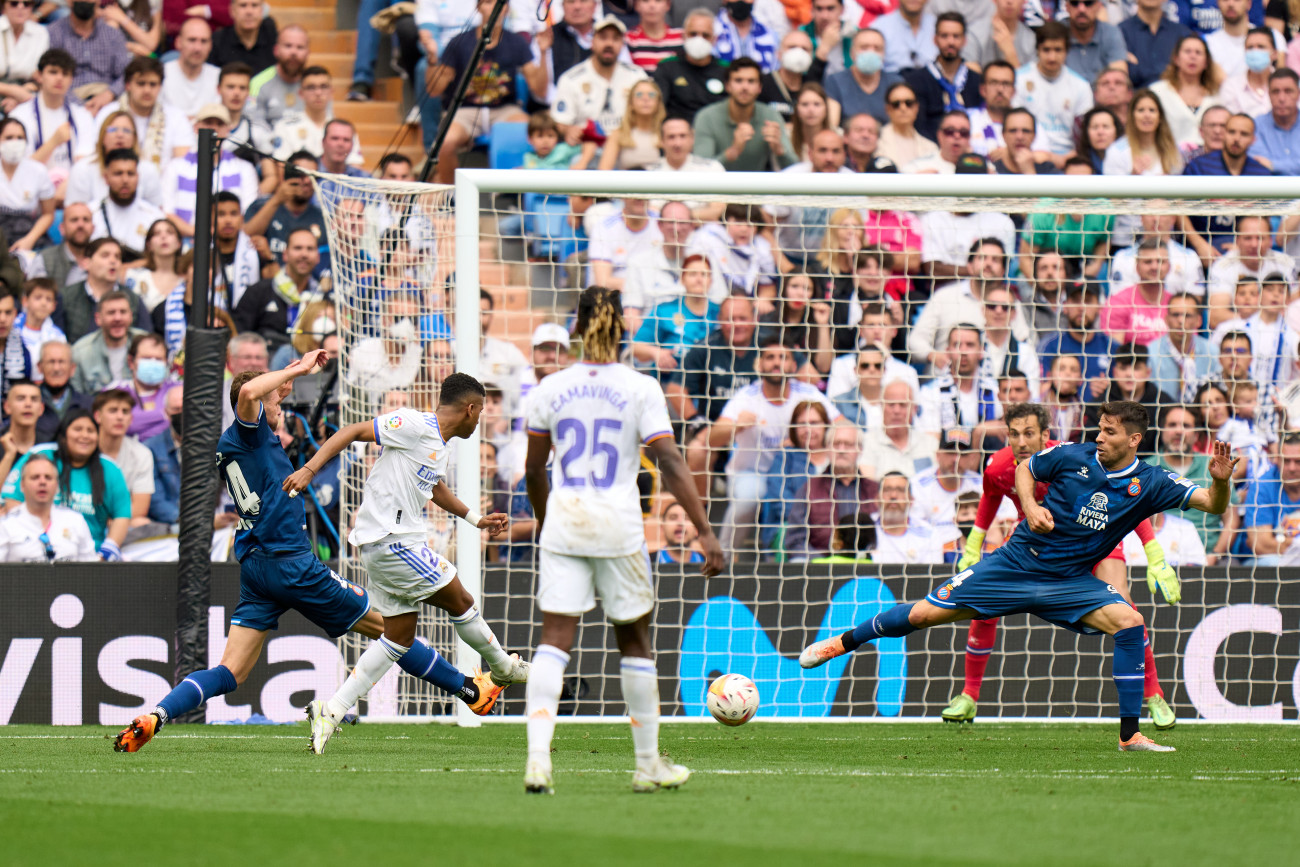 MADRID, SPAIN - APRIL 30: Rodrygo Goes of Real Madrid scores their team's first goal during the LaLiga Santander match between Real Madrid CF and RCD Espanyol at Estadio Santiago Bernabeu on April 30, 2022 in Madrid, Spain. (Photo by Angel Martinez/Getty Images)