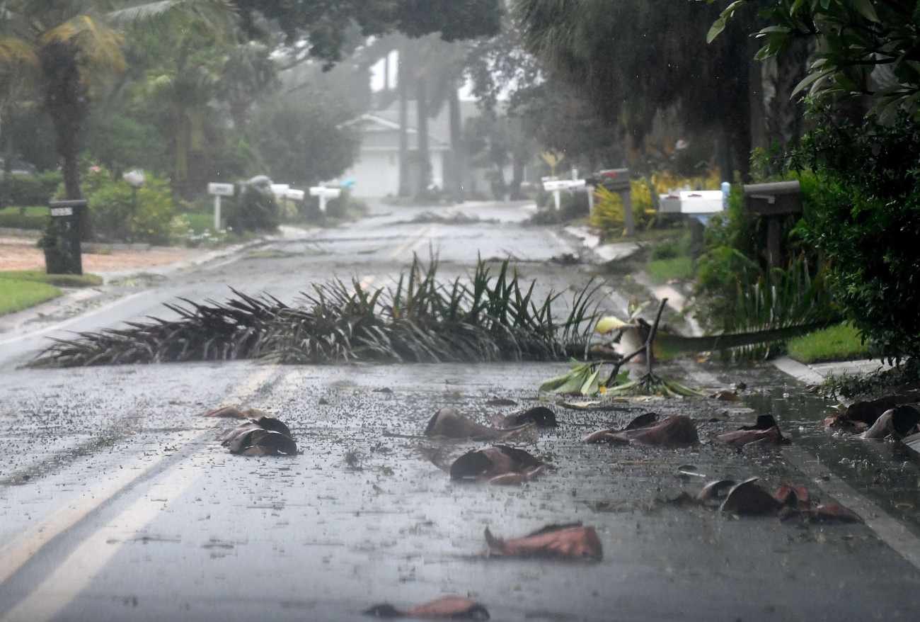 SAINT PETERSBURG, FLORIDA - SEPTEMBER 28: Debris litters a street in a neighborhood of St. Pete Beach as the winds from Hurricane Ian arrive on September 28, 2022 in St. Petersburg, Florida. Ian is hitting the area as a Category 4 hurricane. (Photo by Gerardo Mora/Getty Images)