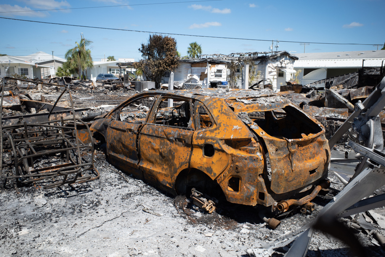A burned vehicle from an electrical fire following Hurricane Ian in Venice, Florida, US, on Friday, Sept. 30, 2022. Two million electricity customers in Florida remained withoutÂ powerÂ Friday morning, according to the tracking site poweroutage.us. Photographer: Tristan Wheelock/Bloomberg via Getty Images
