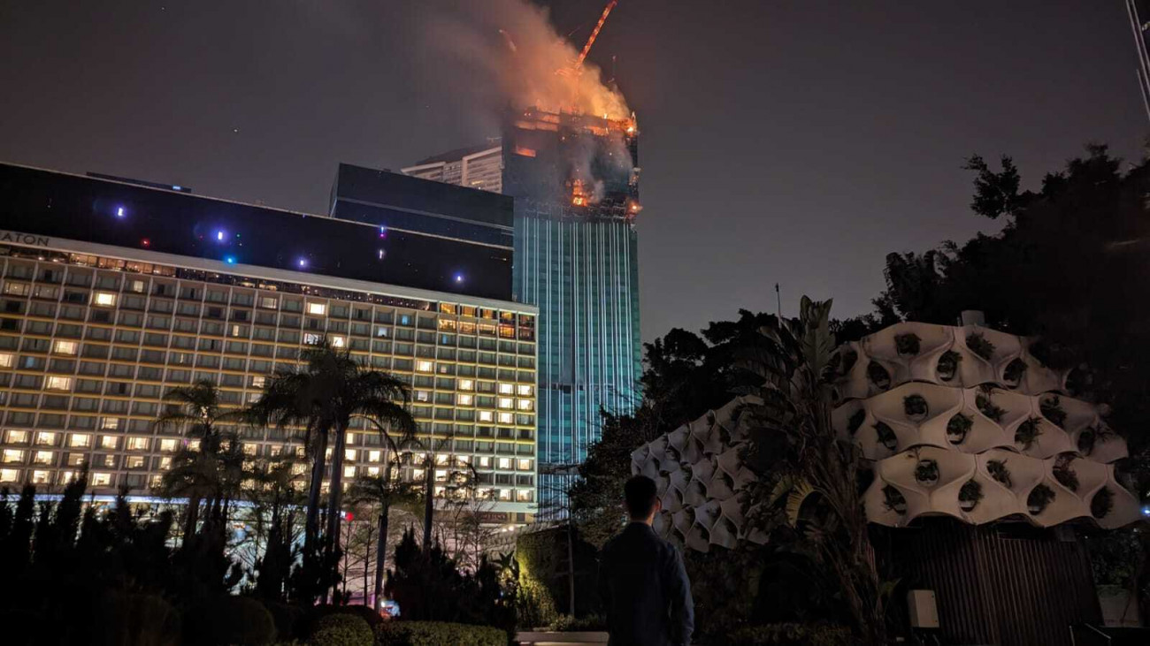 HONG KONG, CHINA - MARCH 2: Fire breaks out at skyscraper which is under construction in Hong Kong, China on March 2, 2023 (Photo by Miguel Candela/Anadolu Agency via Getty Images)