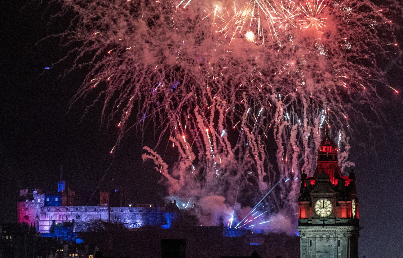 Fireworks explode over Edinburgh Castle and the Balmoral Clock during the street party for Hogmanay New Year celebrations in Edinburgh. Picture date: Monday January 1, 2024. (Photo by Jane Barlow/PA Images via Getty Images)