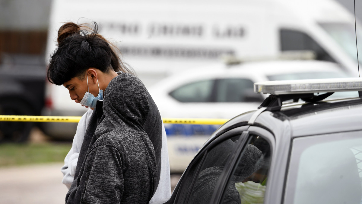 COLORADO SPRINGS, COLORADO - MAY 9: Family members of the six slain people stand near police tape securing the scene of the shooting at the Canterbury Mobile Home Park on May 9, 2021 in Colorado Springs, Colorado. A gunman killed six people at a family birthday party before taking own life, police said. The victims were all members of the same extended family a party attendee said. The shooting was in the 2800 block of Preakness Way in the Canterbury Mobile Home Park. The shooting happened just after midnight. Colorado Springs police Lt. James Sokolik said in a news release. Investigators believe the shooter, who has not been publicly identified, was the boyfriend of a woman at the party. (Photo by Helen H. Richardson/MediaNews Group/The Denver Post via Getty Images)