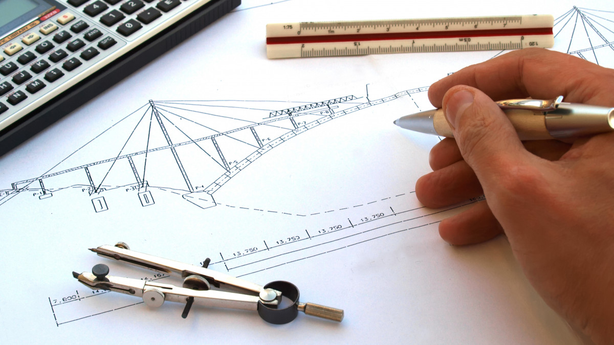 engineer working on a bridge sketch