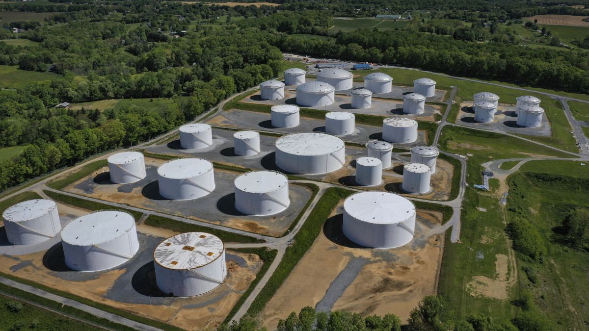 WOODBINE, MD - MAY 13: In an aerial view, fuel holding tanks are seen at Colonial Pipelines Dorsey Junction Station on May 13, 2021 in Washington, DC. The Colonial Pipeline has returned to operations following a cyberattack that disrupted gas supply for the eastern U.S. for days. (Photo by Drew Angerer/Getty Images)