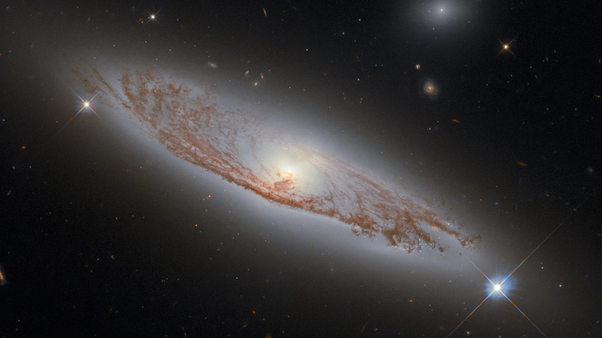 This image shows the spiral galaxy NGC 5037, which is found in the constellation of Virgo and was first documented by William Herschel in 1785. It lies about 150 million light-years away from Earth, and yet it is possible to see the delicate structures of gas and dust within the galaxy in extraordinary detail. This was made possible by Hubbleâs Wide Field Camera 3 (WFC3), which was used to collect the exposures that were combined to create this image.Â  WFC3 is a very versatile camera, as it can collect ultraviolet, visible and infrared light, thereby providing a wealth of information about the objects that it observes. WFC3 was installed on Hubble by astronauts in 2009, during servicing mission 4, which was Hubbleâs fifth and final servicing mission. Servicing mission 4 was intended to prolong Hubbleâs life for another five years. 12 years later, both Hubble and WFC3 remain in active use!
