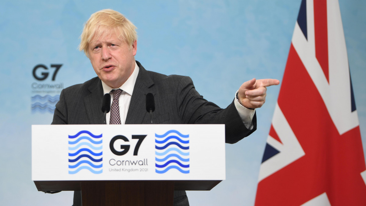 Boris Johnson, U.K. prime minister, gestures as he speaks during a news conference on the final day of the Group of Seven leaders summit in Carbis Bay, U.K., on Sunday, June 13, 2021. Johnson clashed with European Union leaders, warning the U.K. could suspend parts of the Brexit agreement if a dispute over trade rules for goods shipped to Northern Ireland is not resolved. Photographer: Neil Hall/EPA/Bloomberg via Getty Images