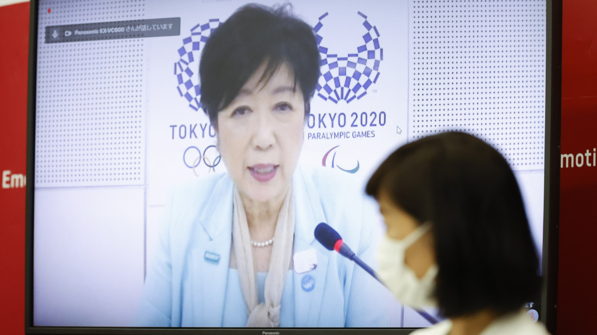TOKYO, JAPAN - JUNE 21: (L to R) Tokyo Governor Yuriko Koike (on a screen) and Tamayo Marukawa, Minister for the Tokyo Olympic and Paralympic Games, speak during a five-party meeting at Harumi Island Triton Square Tower Y on June 21, 2021. President Hashimoto and Tamayo Marukawa, Minister for the Tokyo Olympic and Paralympic Games spoke via teleconference with Thomas Bach President of the International Olympic Committee (IOC), Andrew Parson President of the International Paralympic Committee (IPC) and Tokyo Governor Yuriko Koike. (Photo by Rodrigo Reyes Marin - Pool/Getty Images)