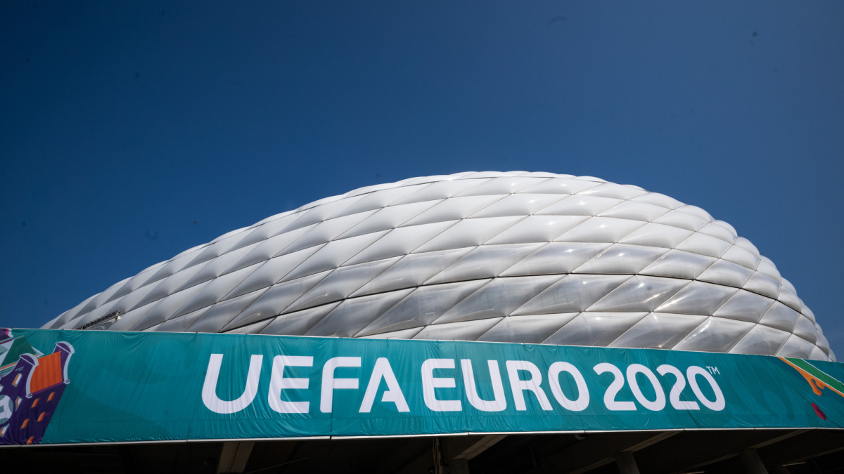 11 June 2021, Bavaria, Munich: A banner with the inscription UEFA Euro 2020 hangs in front of the Allianz Arena. On 15.06.2021 the match of group F, France against Germany, will take place in this stadium. A total of 24 nations will compete in the 2021 European Football Championship. Photo: Peter Kneffel/dpa (Photo by Peter Kneffel/picture alliance via Getty Images)