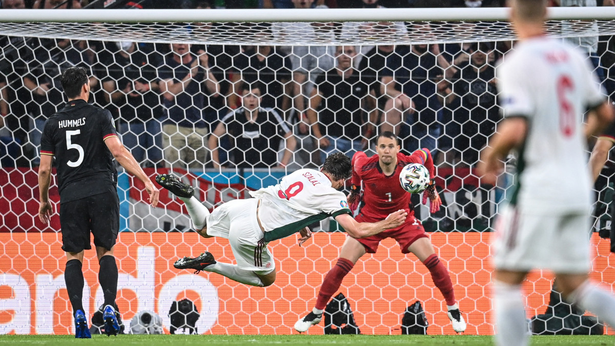 MUNICH, GERMANY - JUNE 23: Adam Szalai (C) of Hungary scores his teams first goal against Goalkeeper Manuel Neuer (R) of Germany  during the UEFA Euro 2020 Championship Group F match between Germany and Hungary at Football Arena Munich on June 23, 2021 in Munich, Germany. (Photo by Markus Gilliar/Getty Images)