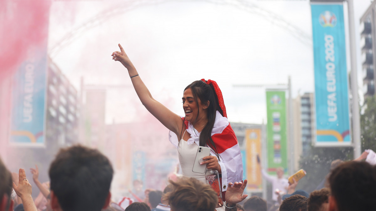 LONDON, ENGLAND - JULY 11: England fans enjoy the pre match atmosphere on Wembley Way prior to the UEFA Euro 2020 Championship Final between Italy and England at Wembley Stadium on July 11, 2021 in London, England. (Photo by Alex Pantling/Getty Images)
