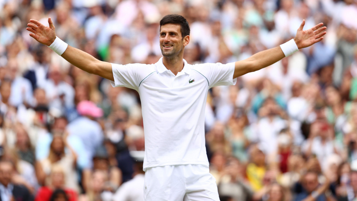 LONDON, ENGLAND - JULY 11: Novak Djokovic of Serbia celebrates winning match point during his mens Singles Final match against Matteo Berrettini of Italy on Day Thirteen of The Championships - Wimbledon 2021 at All England Lawn Tennis and Croquet Club on July 11, 2021 in London, England. (Photo by Julian Finney/Getty Images)
