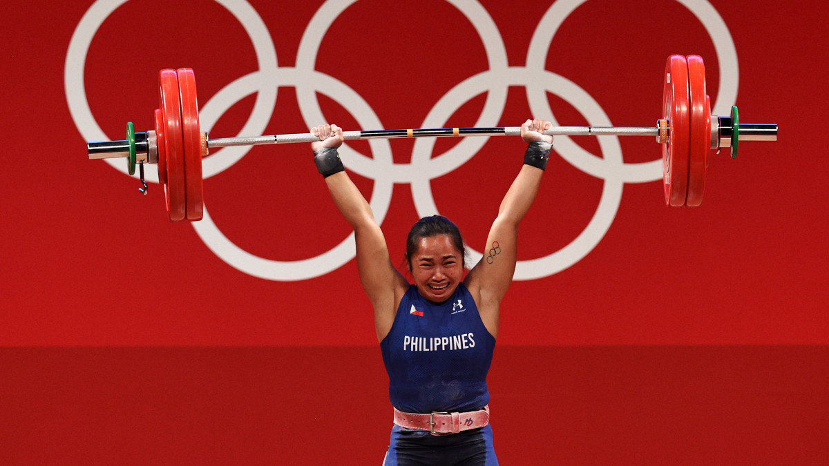 TOKYO, JAPAN - JULY 26: Hidilyn Diaz of Team Philippines competes during the Weightlifting - Womens 55kg Group A on day three of the Tokyo 2020 Olympic Games at Tokyo International Forum on July 26, 2021 in Tokyo, Japan. (Photo by Chris Graythen/Getty Images)