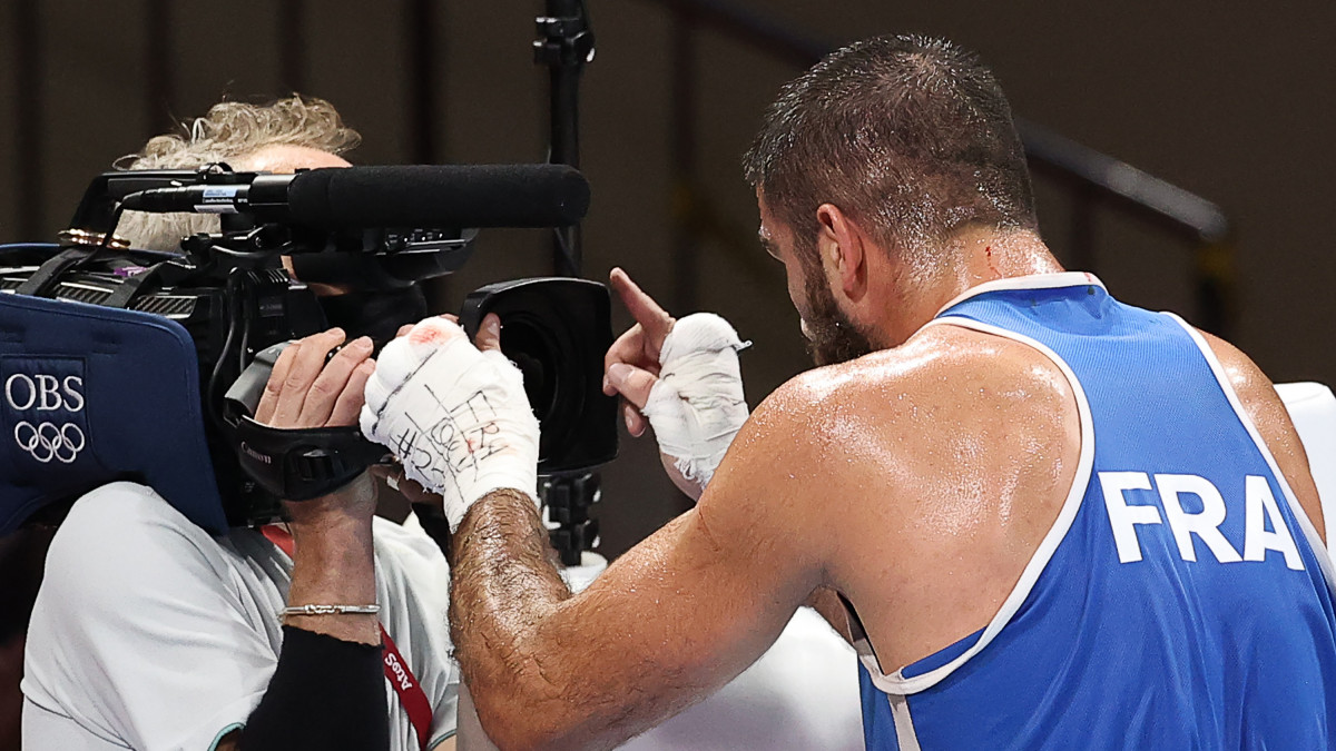 TOKYO, JAPAN - AUGUST 1, 2021: Frances Mourad Aliev (R) stands in front of a cameraman after being disqualified for headbutting Team GBs Frazer Clarke (not pictured) in a mens super heavyweight (+91kg) quarterfinal boxing bout at Kokugikan Arena during the 2020 Summer Olympic Games. Frazer was announced the winner. Valery Sharifulin/TASS (Photo by Valery Sharifulin\TASS via Getty Images)