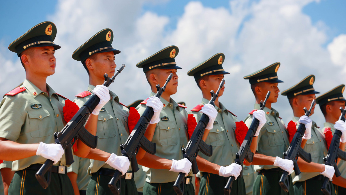 SHENZHEN, CHINA - AUGUST 30 2021: Paramilitary policemen wait to hand over their firearms to colleagues during the retirement ceremony in Shenzhen in south China&#039;s Guangdong province Monday, Aug. 30, 2021. (Photo credit should read Feature China/Barcroft Media via Getty Images)