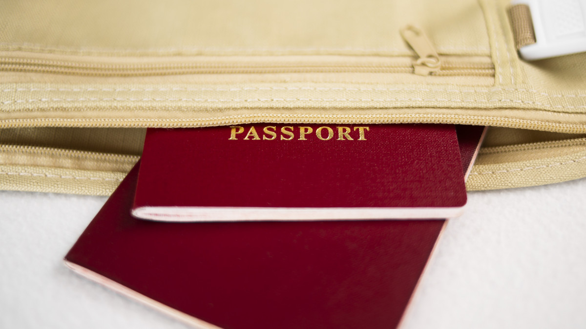 Passport in a belt bag prepared for travel. High quality photo