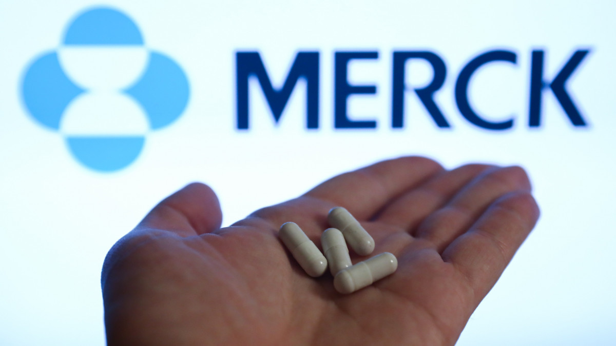 Medicine pills are seen with Merck logo displayed on a screen in the background in this illustration photo taken in Poland on October 10, 2021. (Photo by Jakub Porzycki/NurPhoto via Getty Images)
