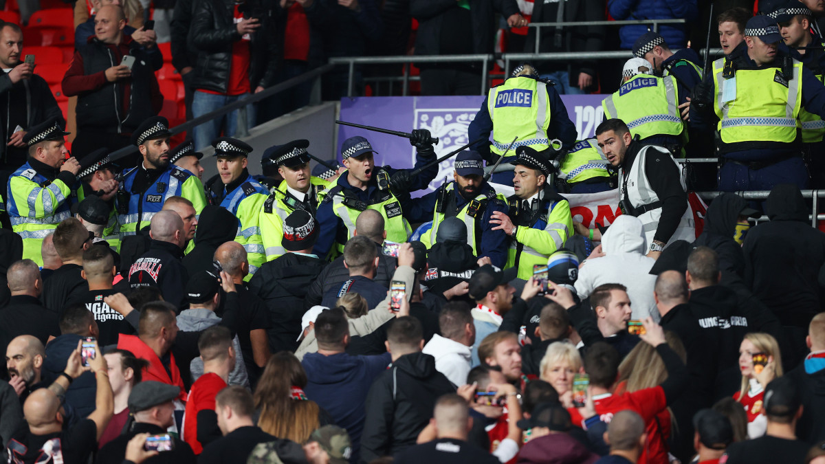 LONDON, ENGLAND - OCTOBER 12: Police clash with Hungary fans during the 2022 FIFA World Cup Qualifier match between England and Hungary at Wembley Stadium on October 12, 2021 in London, England. (Photo by Charlotte Wilson/Offside/Offside via Getty Images)
