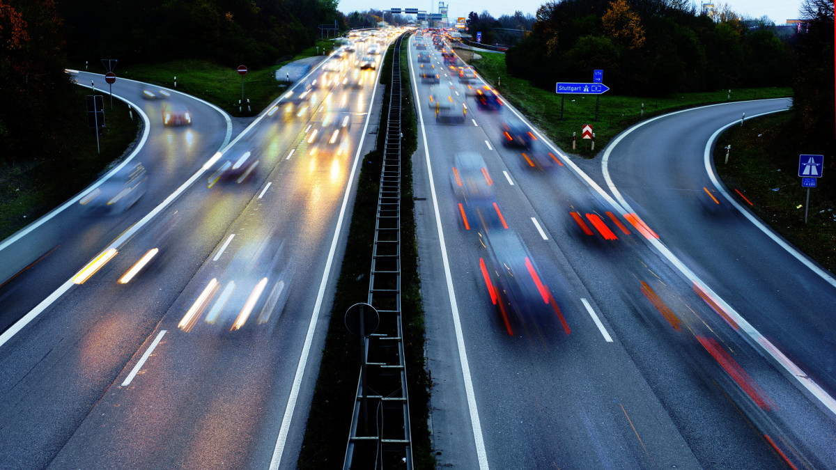 cars on Autobahn highway in Germany in high speed at night