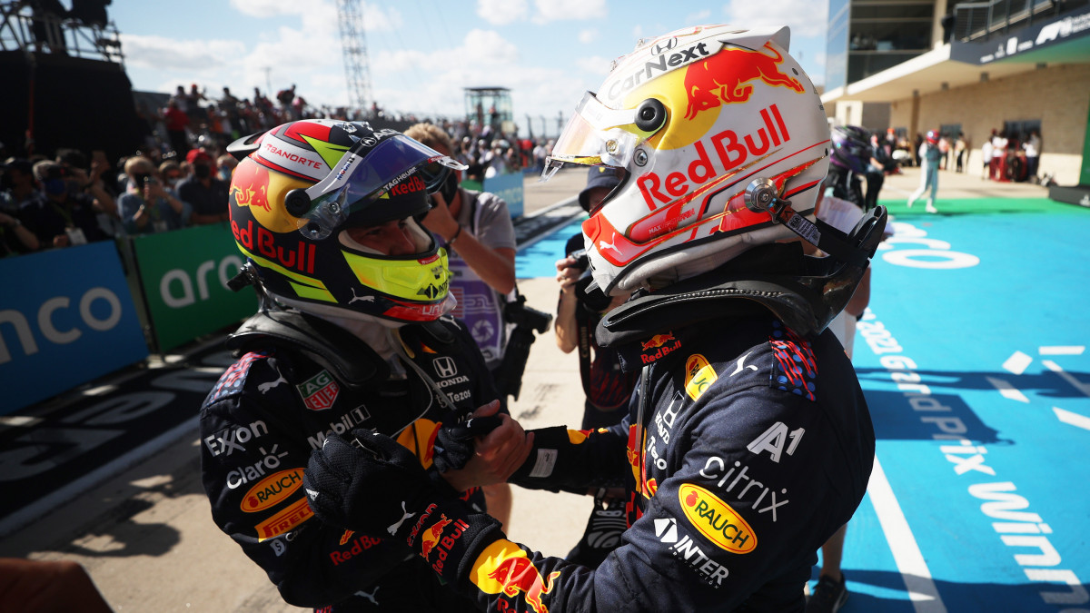 AUSTIN, TEXAS - OCTOBER 24: Race winner Max Verstappen of Netherlands and Red Bull Racing and third placed Sergio Perez of Mexico and Red Bull Racing celebrate in parc ferme during the F1 Grand Prix of USA at Circuit of The Americas on October 24, 2021 in Austin, Texas. (Photo by Chris Graythen/Getty Images)