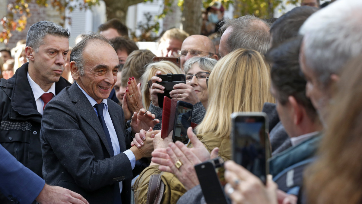 DEAUVILLE, FRANCE - OCTOBER 23: French essayist and political journalist Eric Zemmour shakes hands with his supporters as he arrives to the promotion launch event for his new book France hasnt said its last word (La France nâa pas dit son dernier mot) on October 23, 2021 in La Touques near Deauville, France. Released in bookstores on Thursday, September 16, Eric Zemmourâs new book, La France nâa pas dit son dernier mot is at the top of the sales list. Initially printed at 200.000 copies, it is now out of stock in many bookstores. The far-right polemicist is given the run-off in the presidential election after a new Ipsos poll for Le Monde newspaper. He is also seen as the candidate who worries the French the most, along with Marine Le Pen. Eric Zemmour is not currently a candidate for the 2022 Presidential election. (Photo by Chesnot/Getty Images)