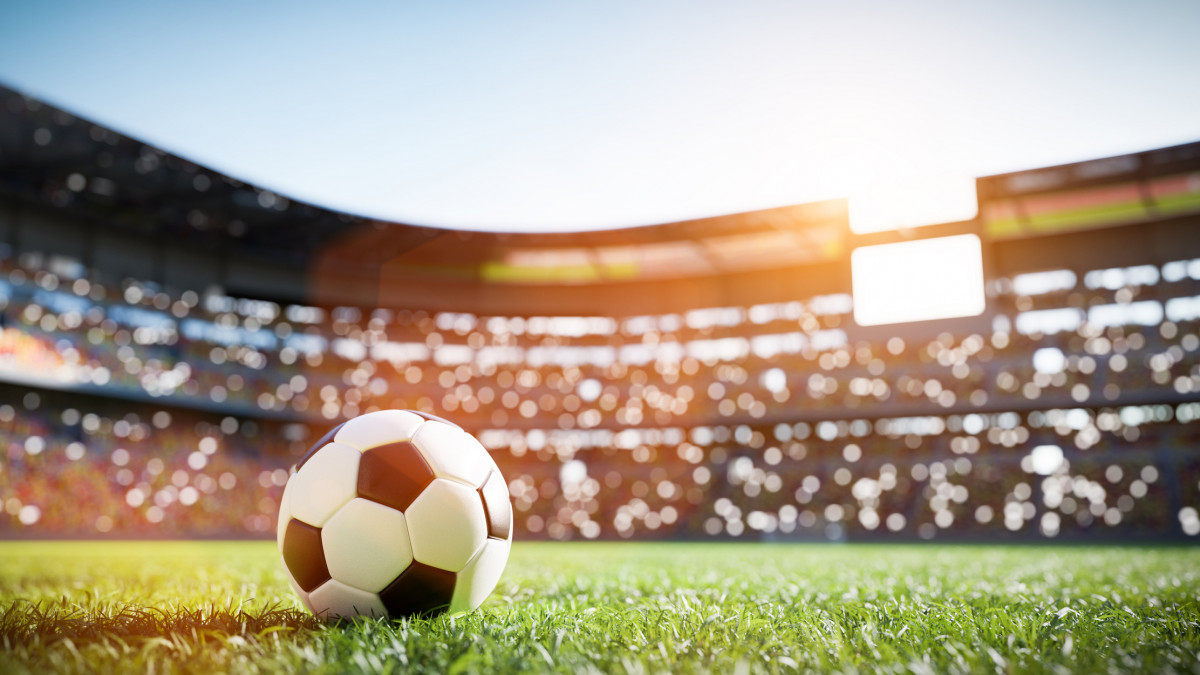 Football soccer ball on grass field on stadium. Sport