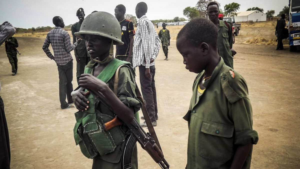 SOUTH SUDAN - MARCH 3:  Child soldier is seen in military uniform in the South Sudan Democratic Movement/Army (SSDM/A), Jonglei State, South Sudan on March 1, 2014. (Photo by Samir Bor/Anadolu Agency/Getty Images)