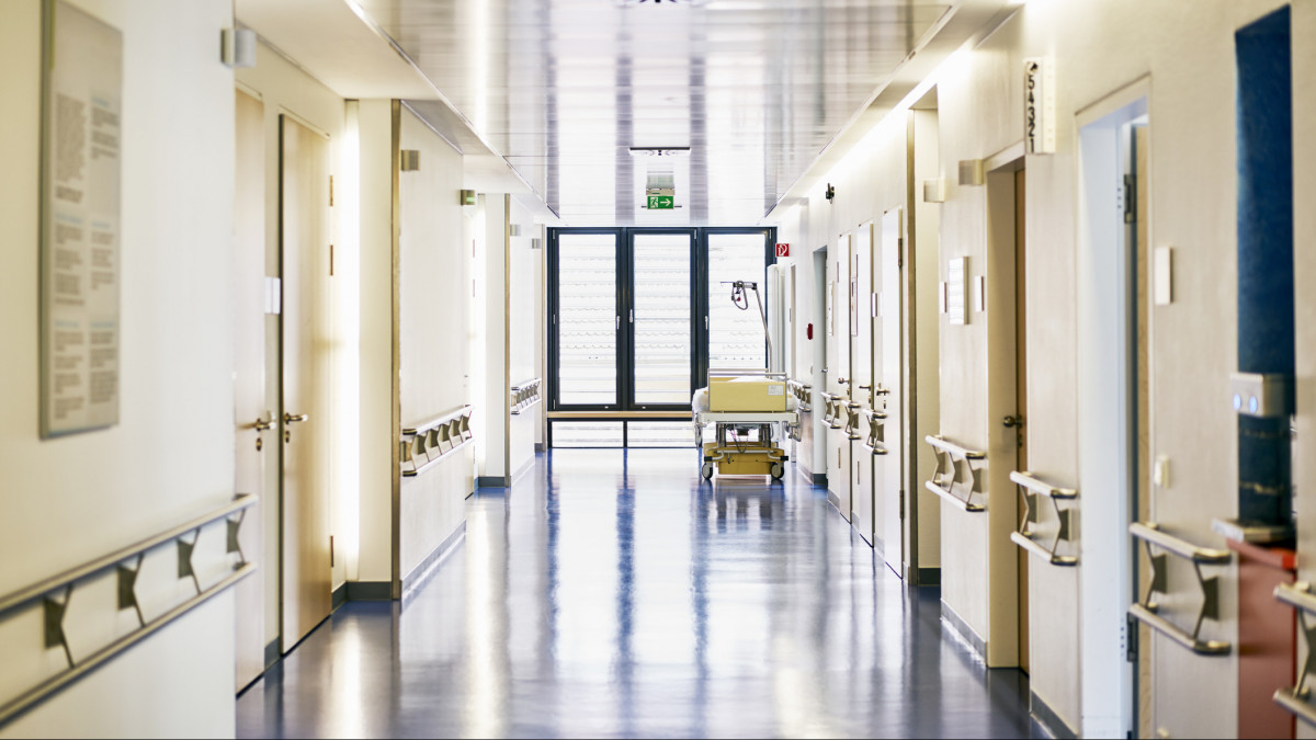 Hospital with corridor and bed without persons in landscape format