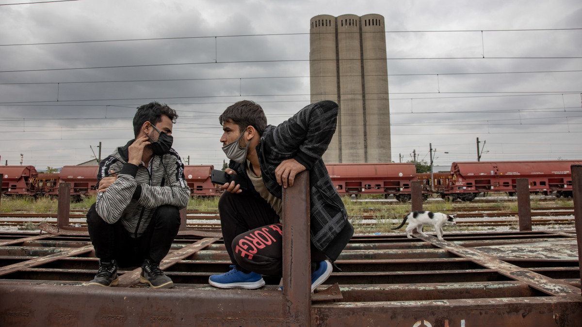 Young men from Afghanistan as seen on the old carriages waiting for the train. Refugees and migrants are seen at the railway junction and the old abandoned train carriages living and sleeping temporarily in Dialogi near Thessaloniki. Asylum seekers mostly from Afghanistan are waiting for cargo trains to jump on and travel towards Idomeni that leads to Northern Macedonia and Serbia, following the Balkan Route to Europe. Most of them walked from Turkey towards Greece or some used smugglers with cars. Thessaloniki Greece on November 6, 2021 (Photo by Nicolas Economou/NurPhoto via Getty Images)