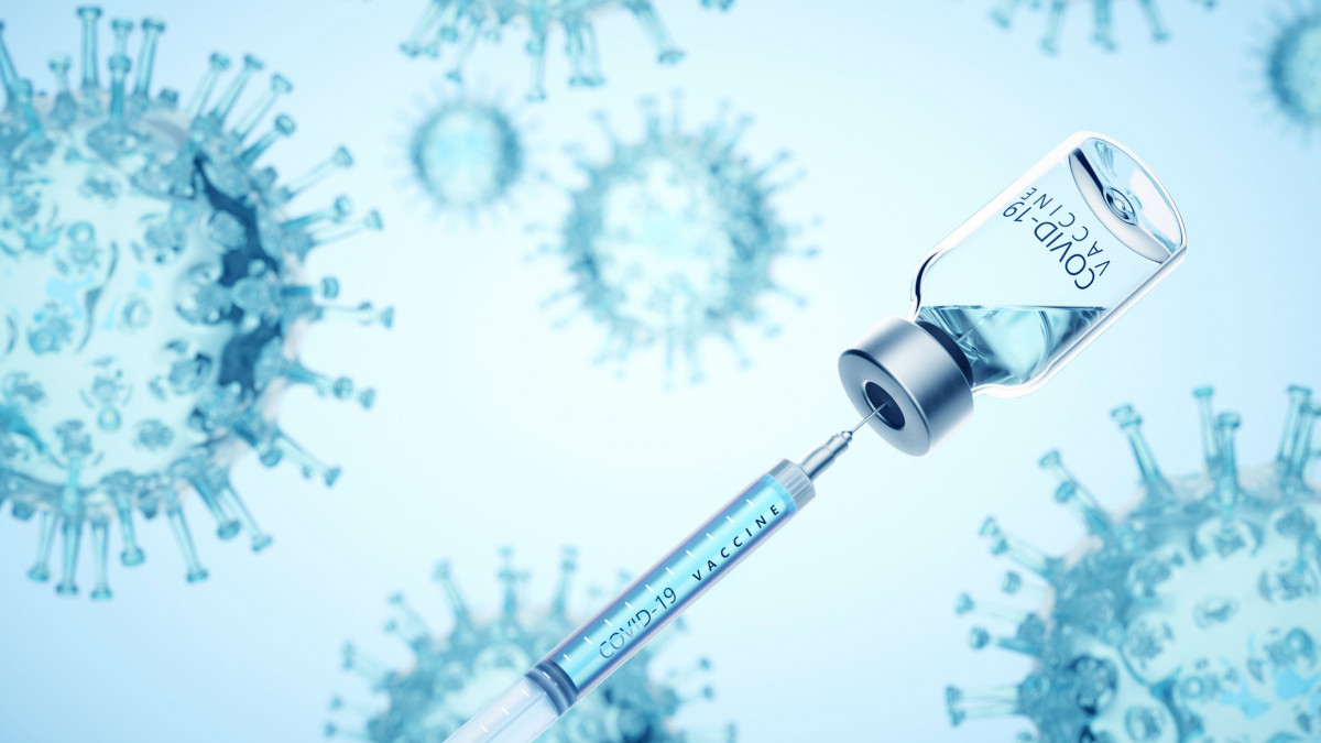 Digital generated image of syringe filling of COVID-19 vaccine from bottle against viruses on blue background.