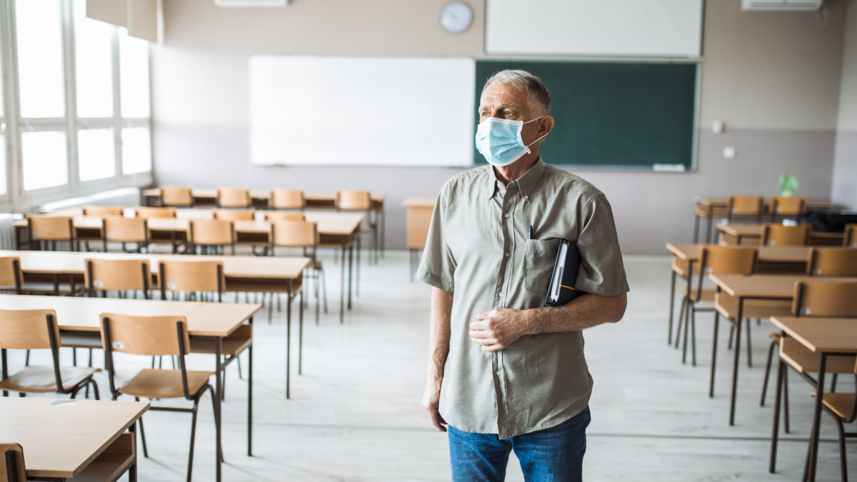 Teacher in an empty classroom during corona virus crisis