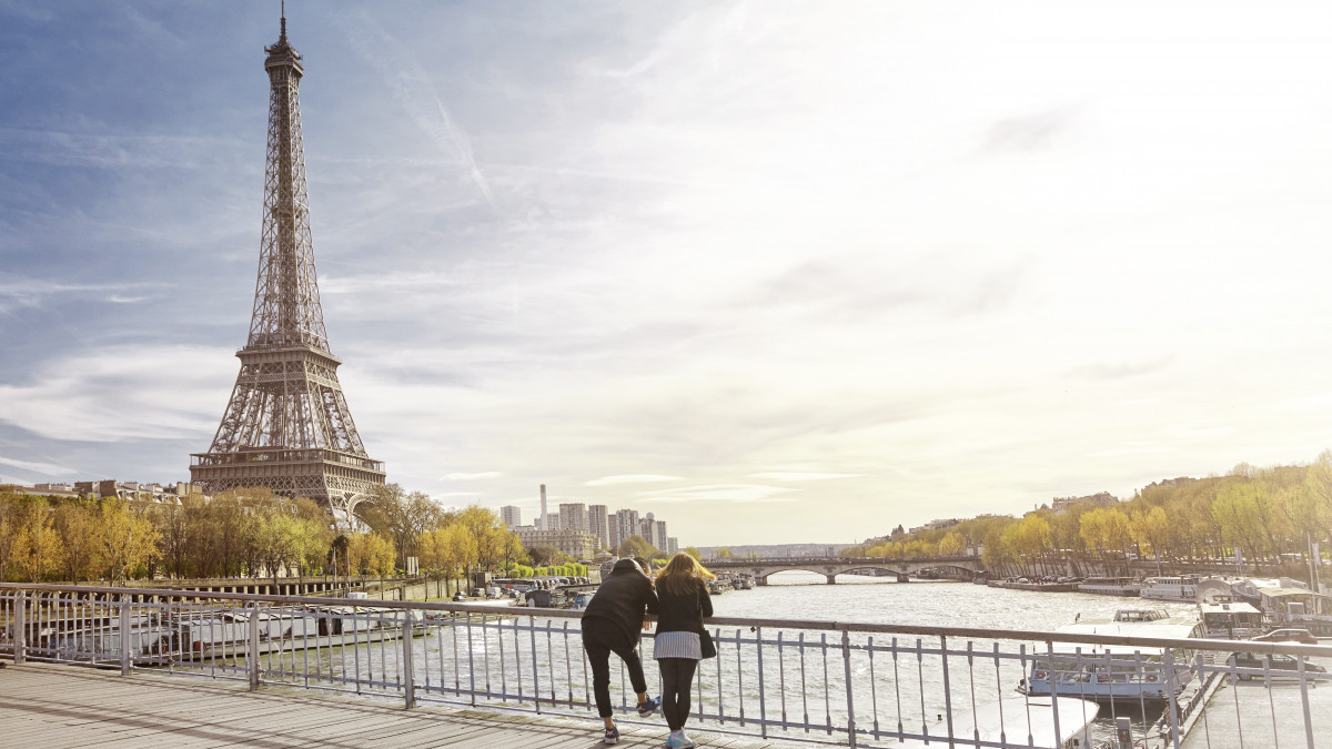 Tourist couple looking at The Eiffel Tower, Paris, France