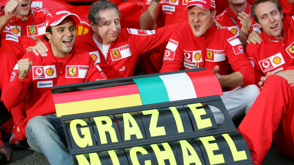 SAO PAULO, BRAZIL - OCTOBER 22:  Michael Schumacher of Germany and Ferrari,  Felipe Massa, and Jean Todt celebrate with their team-mates at the end of the Brazilian Formula One Grand Prix at the Autodromo Interlagos on October 22, 2006 in Sao Paulo, Brazil.  (Photo by Paul Gilham/Getty Images)