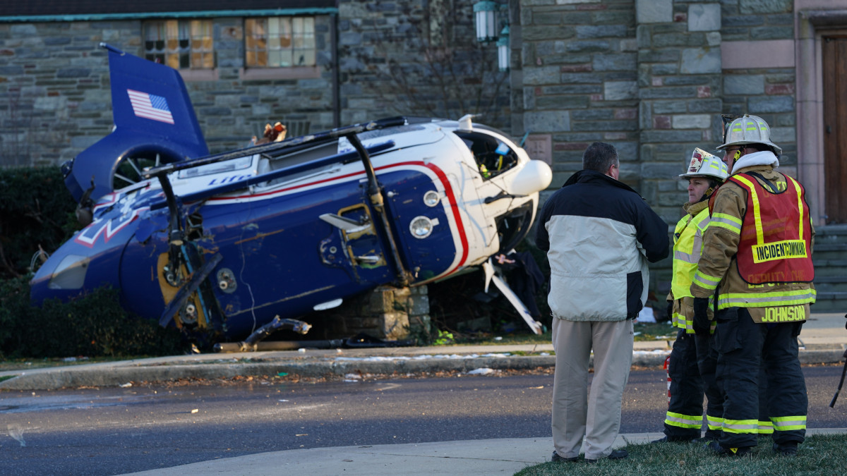 PHILADELPHIA, USA - JANUARY 11: A medical helicopter crash landed on the lawn of the Drexel Hill United Methodist Church in Drexel Hill, PA on January 11th, 2022. Three crew members and a patient were able to escape from this medical helicopter which crashed in front of Drexel Hill United Methodist church Burmont road and Bloomfield Ave. in Upper Darby. Upper Darby police Superintendent Timothy Bernhardt called it a miracle everyone was able to get out. (Photo by Wolfgang Schwan/Anadolu Agency via Getty Images)