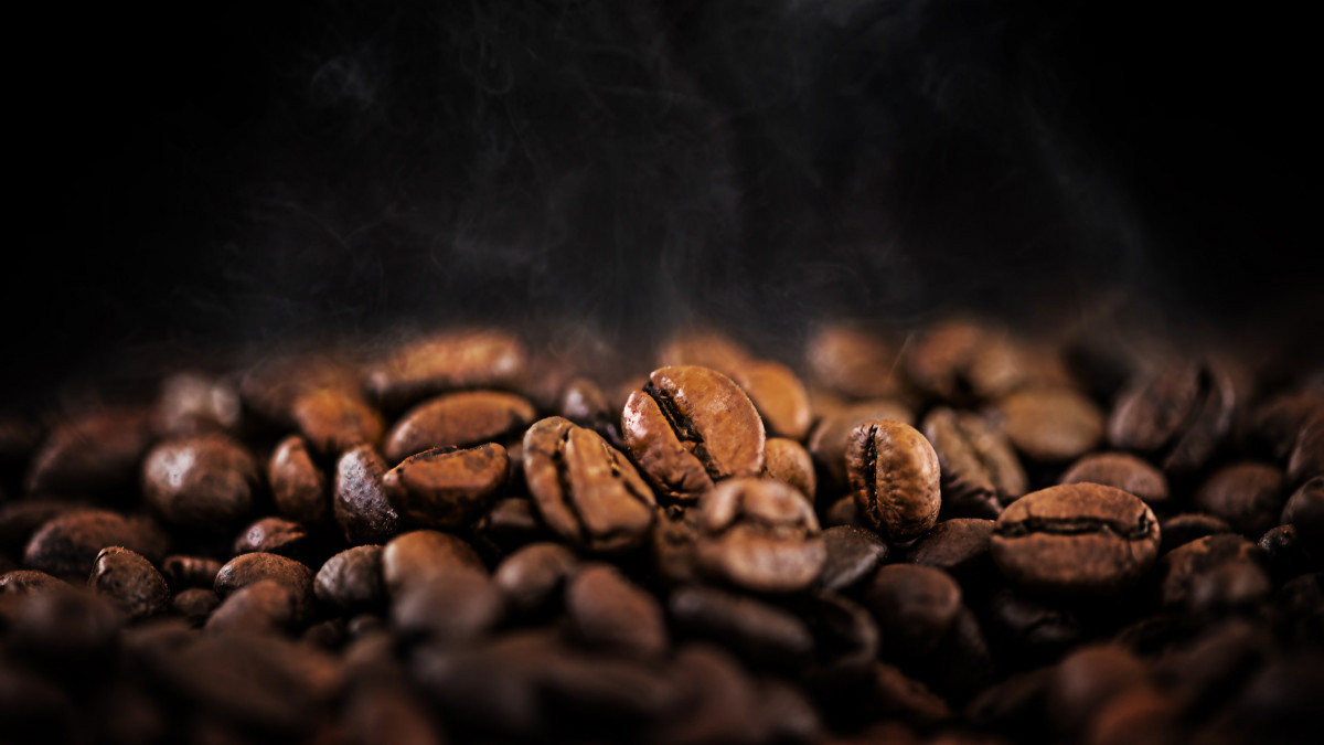 Hot Coffee Beans on Dark Background