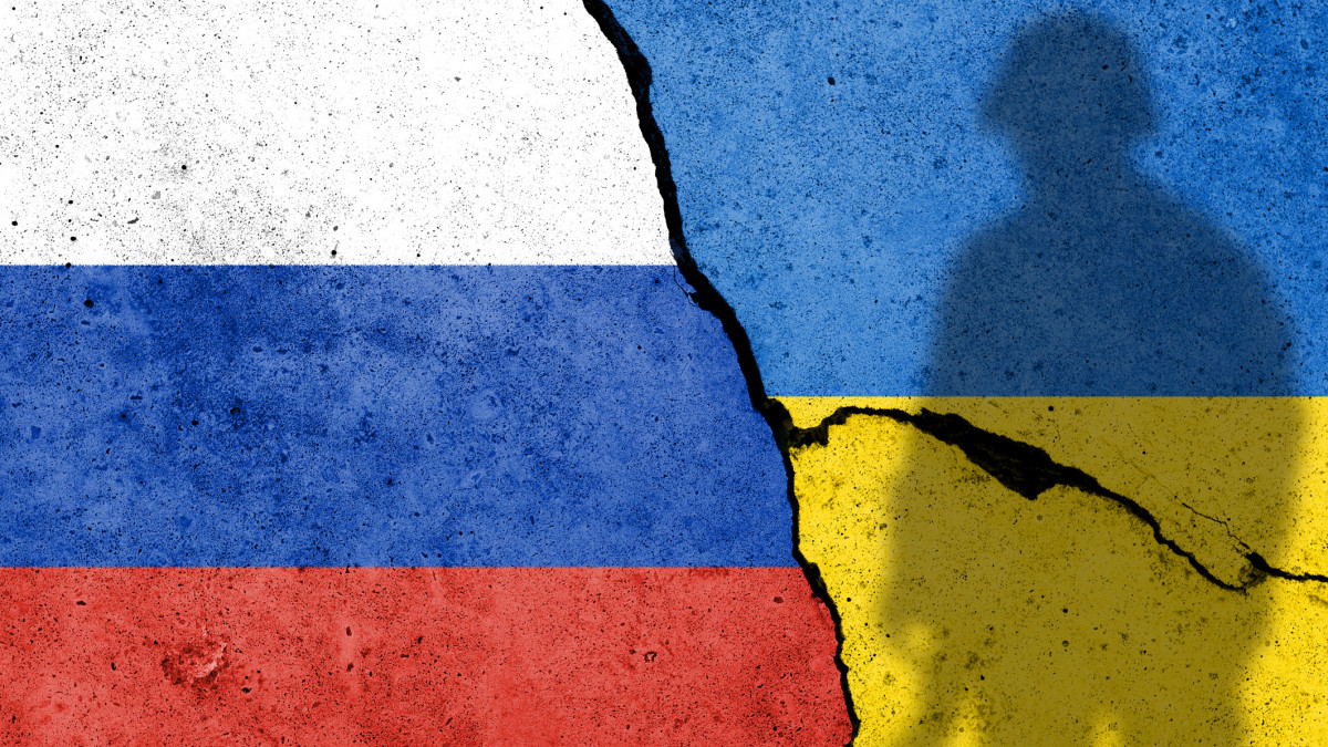 Flag of Russia and Ukraine painted on a concrete wall. Relationship between Ukraine and Russia