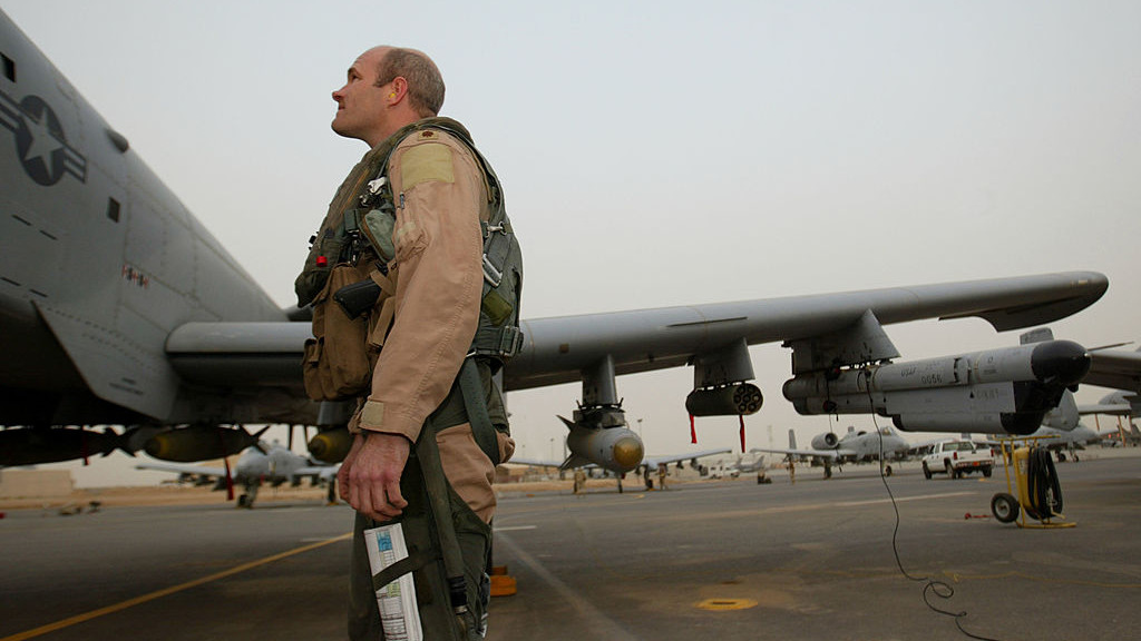 KUWAIT - MARCH 26:  U.S. Major Mike Shenk looks at the A-10 fighter jet moments before boarding the aircraft for his mission into Iraq March 26, 2003 as Operation Iraqi Freedom continues after a pause in the air campaign due to bad weather.  (Photo by Paula Bronstein/Getty Images)