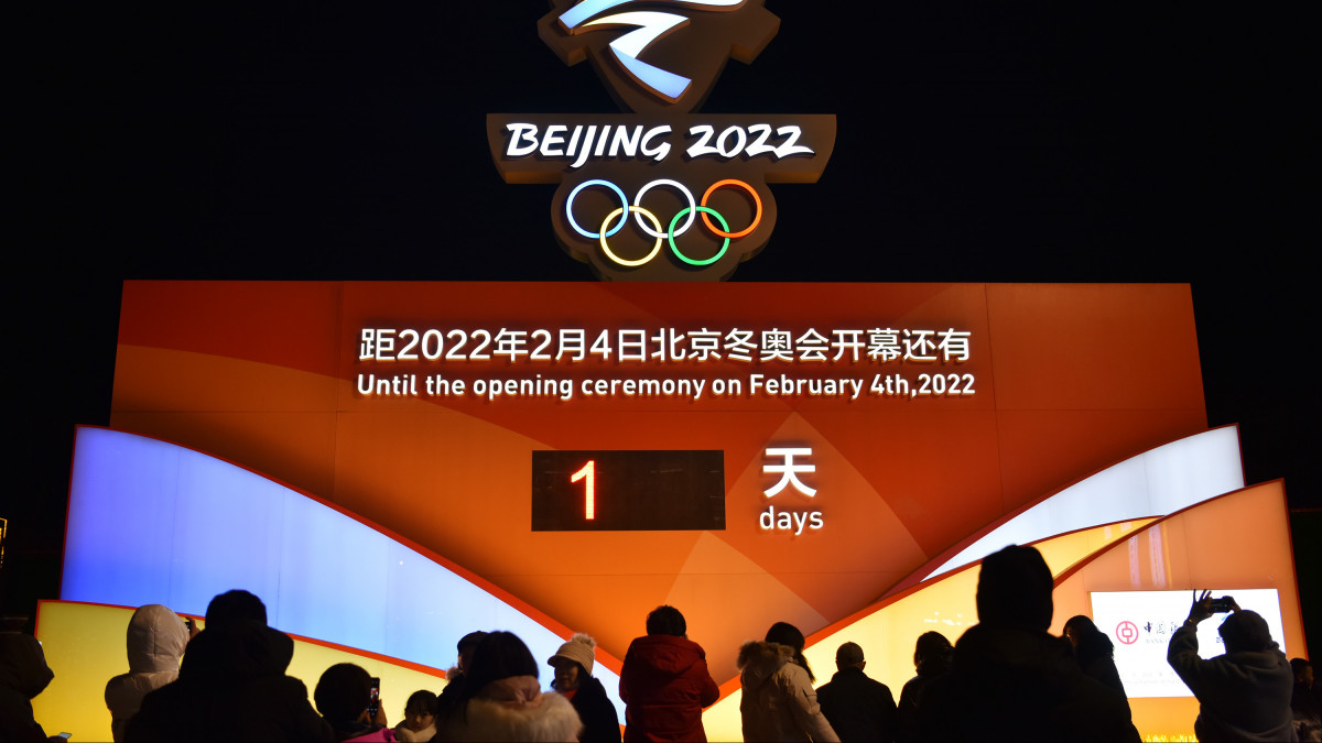 ZHANGJIAKOU, CHINA - FEBRUARY 02: People take photos of a countdown clock displaying one-day countdown to the opening of the Beijing 2022 Winter Olympics on February 2, 2022 in Zhangjiakou, Hebei Province of China. (Photo by Chen Xiaodong/VCG via Getty Images)