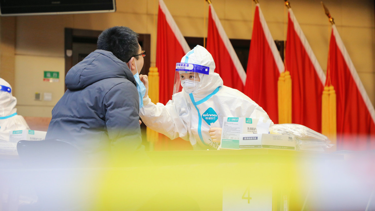 BEIJING, CHINA - FEBRUARY 03: A person receives COVID-19 nucleic acid test at Fengtai District during the Chinese Spring Festival holiday on February 3, 2022 in Beijing, China. (Photo by Zheng Yishuo/Qianlong.com/VCG via Getty Images)